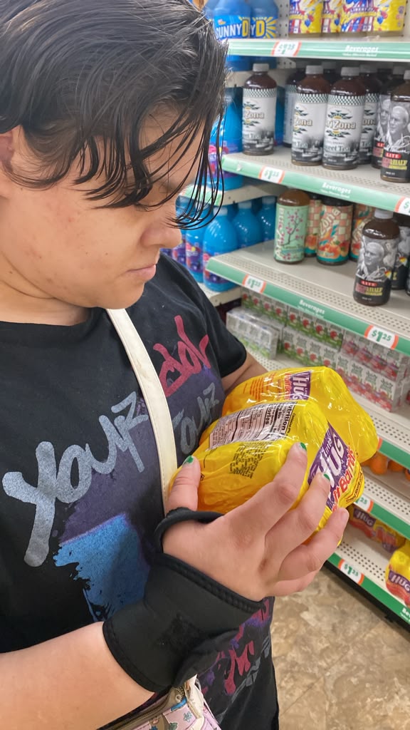Reading labels and comparing Prices and health wise.
